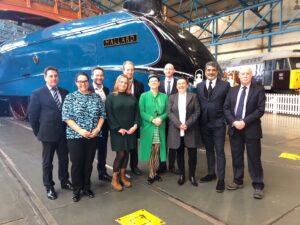 Photo of minister in front of Mallard train